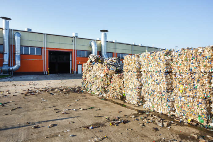 Plastic bales at the waste processing plant. Separate garbage collection. Recycling and storage of waste for further disposal. Business for sorting and processing of waste.